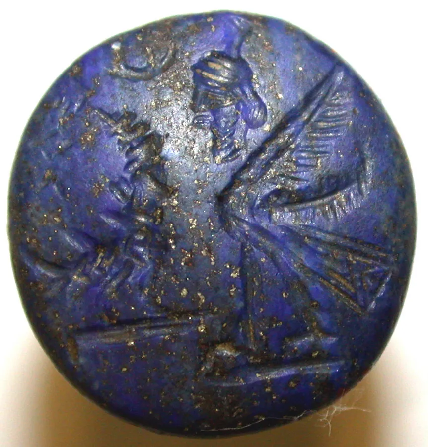 A Babylonian lapis conical seal: An inscribed stamp seal of lapis lazuli in a cone shape, 2.7 cm high, from the Neo-Babylonian era.