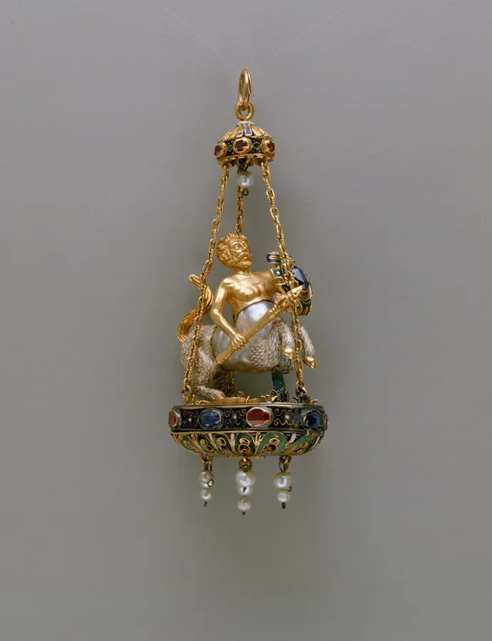 A centaur made from a baroque pearl: A pendant 8.9 cm high whose body is one irregular baroque pearl, finished in enamelled gold set with sapphires and rubies, with more pearls hanging below.