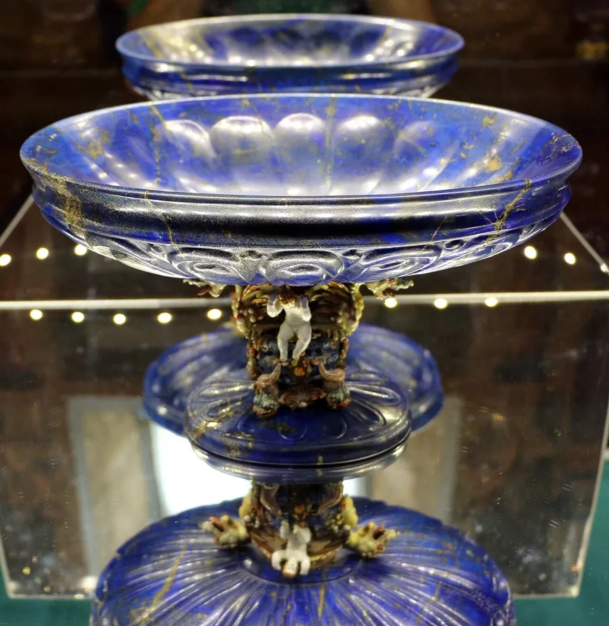 A lapis cup with a Paris gold mount: A cup carved from lapis lazuli in Florence or Milan in the late 1500s, later fitted with an enamelled gold mount by the Paris goldsmith Pierre Delabarre. It belongs to the Dauphin’s Treasure, the collection of hardstone vessels that Philip V of Spain inherited from his father, the Grand Dauphin.