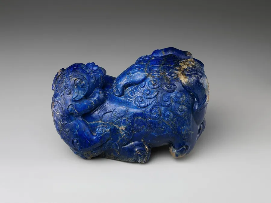 A lapis lion and cub: A Qing dynasty carving of a lion with its cub in lapis lazuli.