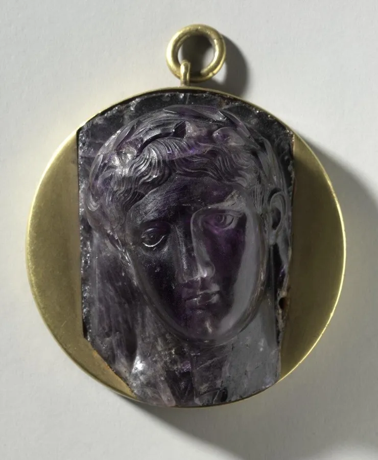 A Roman amethyst cameo: The head of a woman carved in relief from amethyst, Roman, 1st century AD.