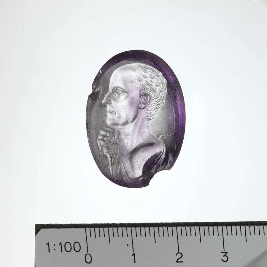 A Roman amethyst intaglio: A portrait of a man carved into amethyst, Roman.