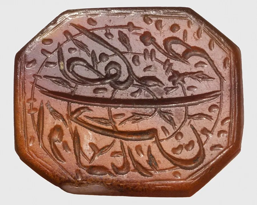 An Ottoman octagonal seal: An octagonal carnelian seal, wheel cut, inscribed in Turkish: "May the Divine Grace manifest, Yar Hasan". Ottoman Turkey, 18th century.
