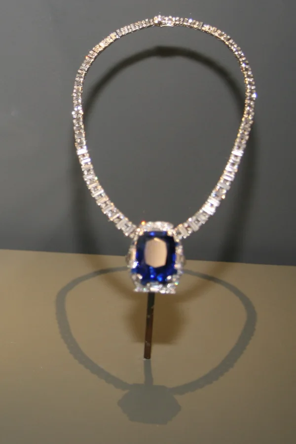 The Bismarck Sapphire Necklace: A blue sapphire of about 98.6 carats from Myanmar, set by Cartier with diamonds.