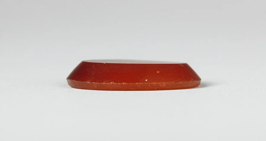 A Roman carnelian seal of Anubis: A carnelian intaglio carved with the Egyptian jackal god Anubis, Roman period.