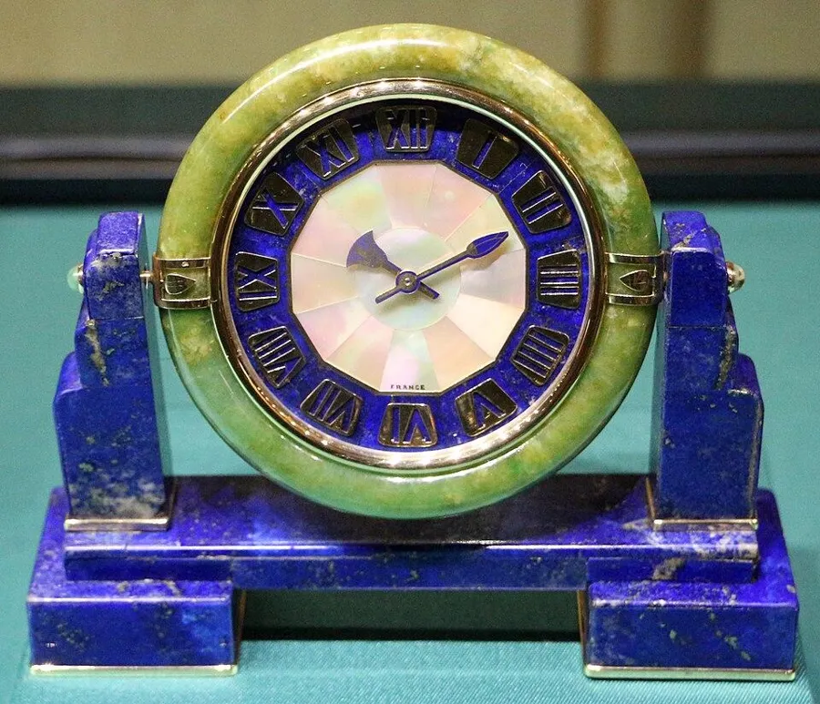 A Cartier lapis lazuli clock, 1925: A table clock by Cartier New York, 1925, of gold, silver and lapis lazuli, shown in the exhibition Lapislazzuli: Magia del blu.