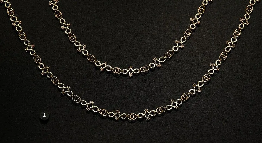 A necklace from the Cheapside Hoard: A gold and white enamel necklace of linked lovers’ knots, England, 1590 to 1620.
