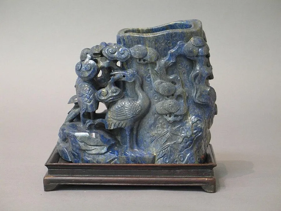 A Chinese lapis mountain carving: A carved block of lapis lazuli showing a landscape, China.