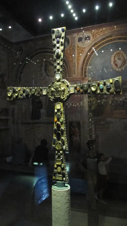 The Cross of Desiderius: A processional cross covered in gems, cameos and gold-glass portraits, 9th century, named after the last Lombard king.