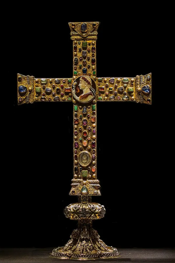 The Cross of Lothair: A gold processional cross set with gems and pearls, made around 1000 AD, with an ancient Roman cameo of the emperor Augustus at its centre.