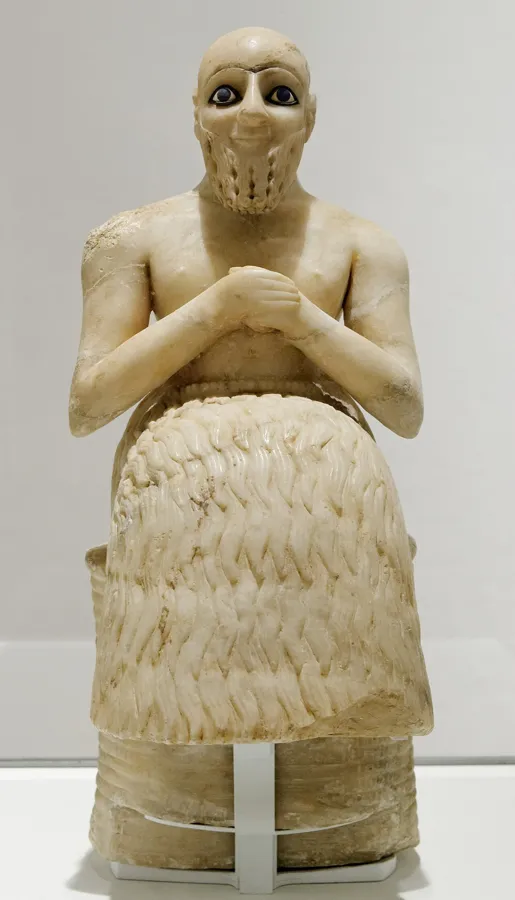 Ebih-Il and his lapis eyes: An alabaster statue of Ebih-Il, a high official of the city of Mari, seated with his hands clasped. His eyes are inlaid with shell and lapis lazuli.