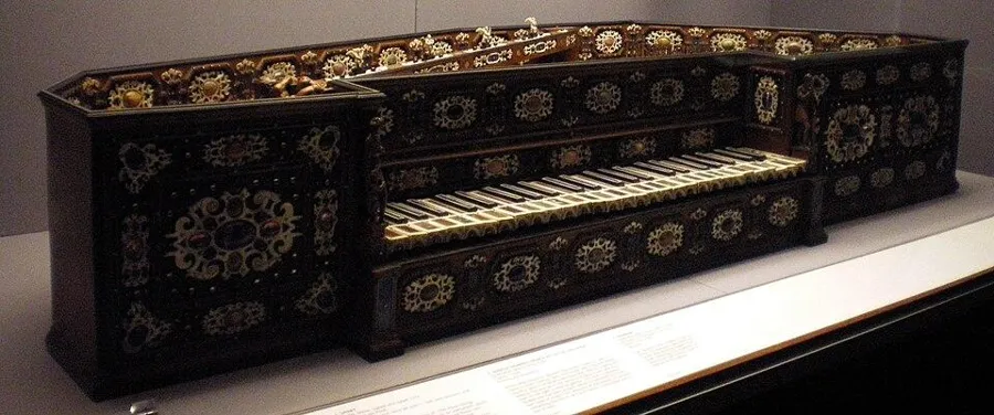 A spinet set with 1,928 gems: A small keyboard instrument of boxwood, ebony and ivory set with 1,928 precious and semi-precious stones, signed by Annibale dei Rossi, Milan, 1577.