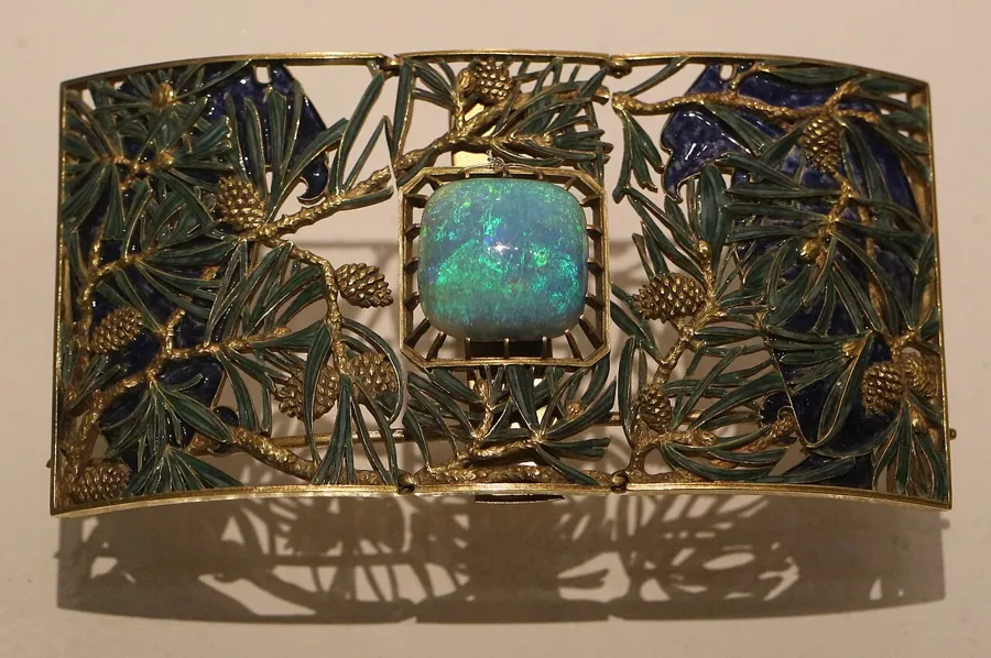 Lalique’s eagle and pines choker plaque: A choker plaque of gold, enamel and opals showing an eagle among pine trees, by René Lalique.