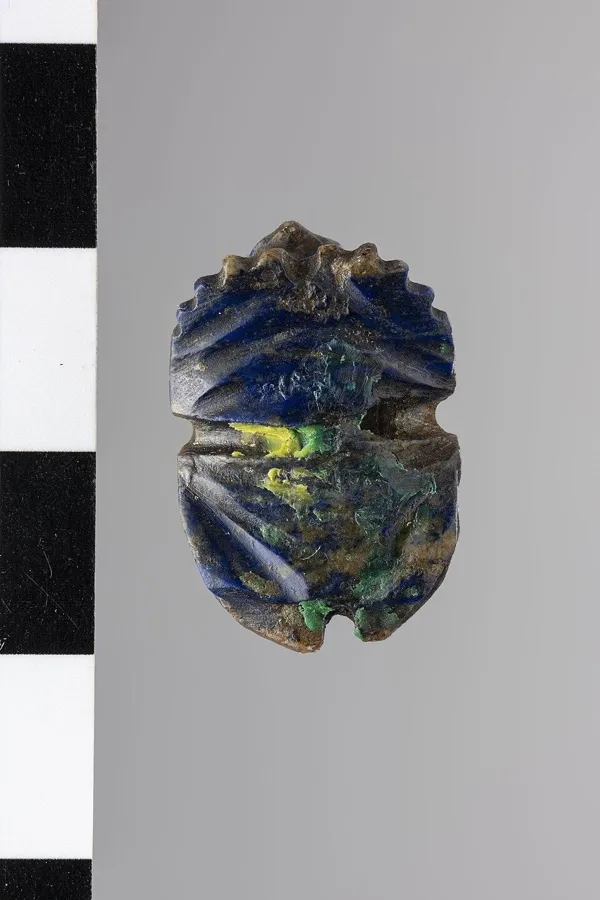 A hawk-headed scarab in lapis: A scarab beetle with a falcon’s head, carved from one piece of lapis lazuli, ancient Egypt.