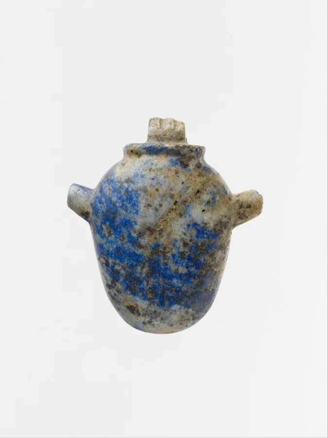 An Egyptian lapis lazuli heart amulet: A heart-shaped amulet carved from lapis lazuli.