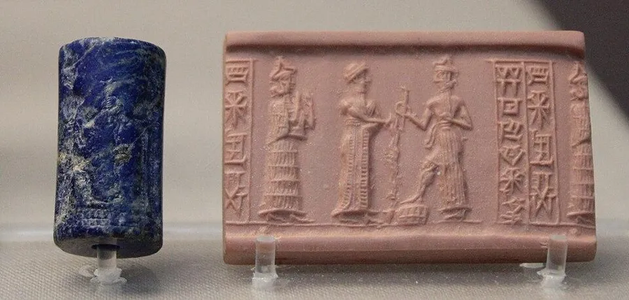 A lapis seal: a king and the sun god: A lapis lazuli cylinder seal showing a king pouring an offering before the sun god Shamash, from a tomb at Ur, about 1900 BC. It belonged to a man named Bur-Dagan.
