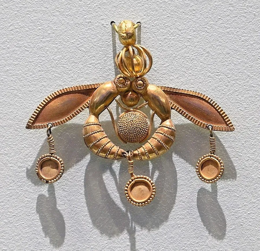 The Malia bee pendant: A gold pendant of two bees around a drop of honey, Minoan Crete, about 1800 to 1700 BC.