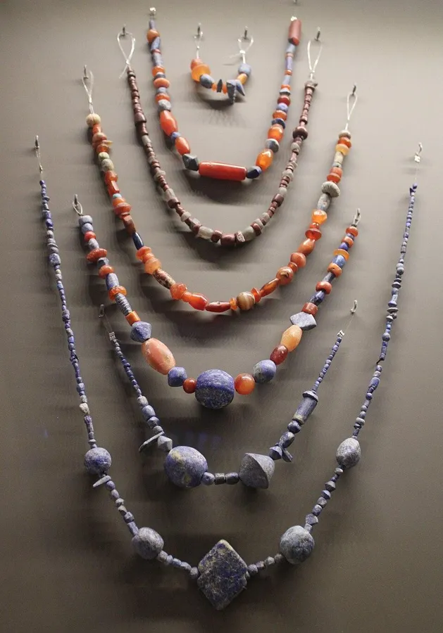Necklaces from the temple of Ishtar at Mari: Bead necklaces of lapis lazuli, carnelian and other stones from the temple of Ishtar at Mari, Syria, about 2500 to 2340 BC.