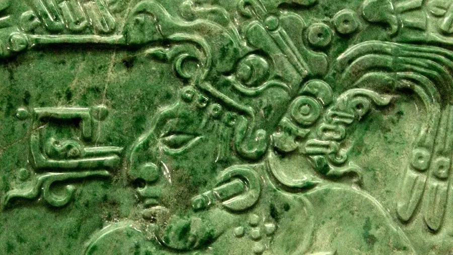 A Maya jade plaque of a king: A jade plaque carved with a seated Maya king, Classic period, found far from home at Teotihuacan.