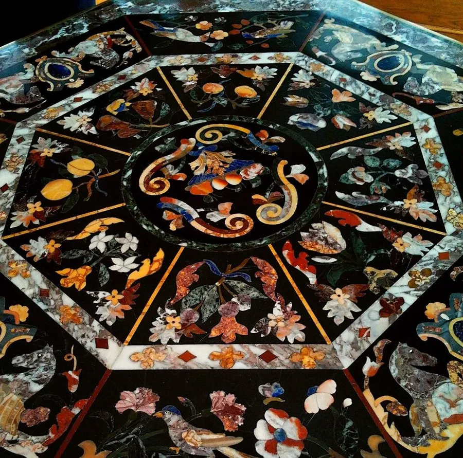 A pietre dure tabletop from Florence: A tabletop of inlaid hardstones with lapis lazuli, made in the Florentine pietre dure tradition.