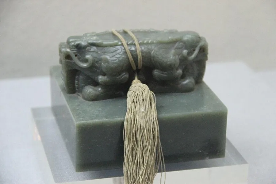 A Qing jade seal: A jade seal carved with a beast on top, Qing dynasty.