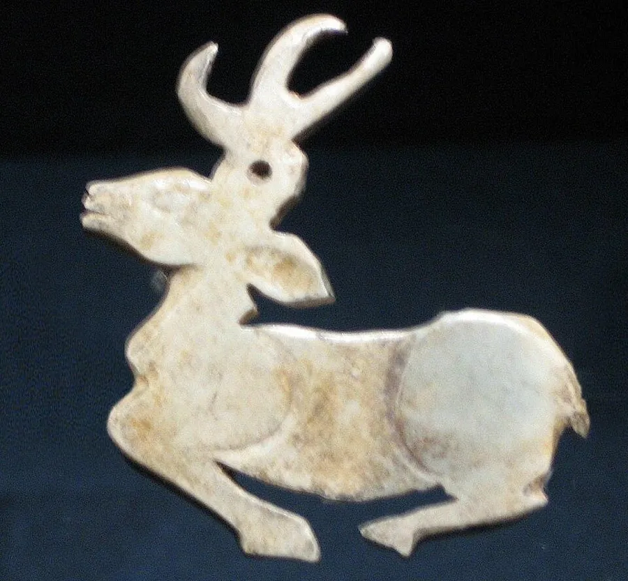 A Shang jade deer: A flat jade deer with tall antlers, Shang dynasty (about 1600 to 1046 BC).