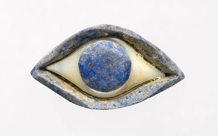 A Sumerian eye inlay: An eye for a statue, made of white stone with a pupil of lapis lazuli, Sumer.