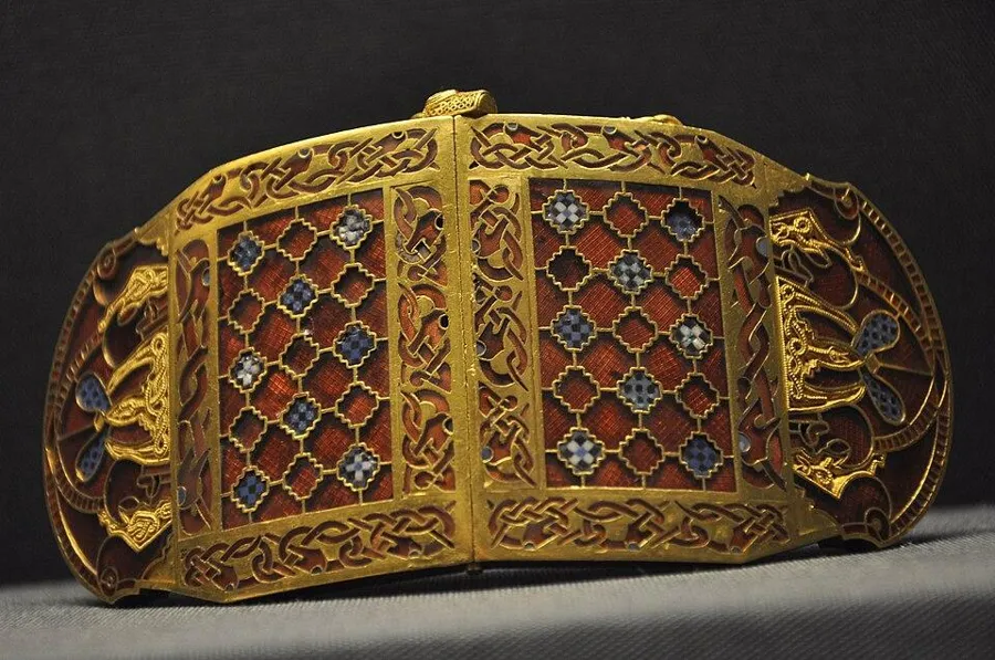 The Sutton Hoo shoulder clasps: Gold shoulder clasps inlaid with hundreds of cut garnets and coloured glass, early 7th century.
