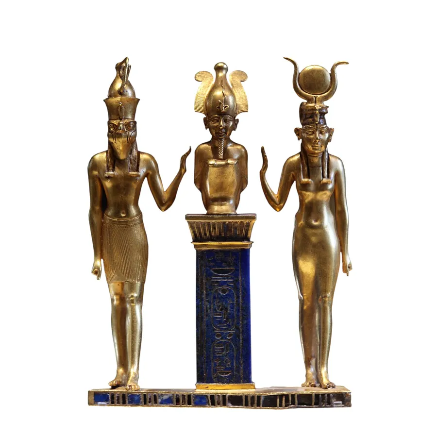 The Triad of Osorkon II: A gold pendant 9 cm high: Osiris crouches on a pillar of lapis lazuli carved with the king’s name, flanked by Horus and Isis.