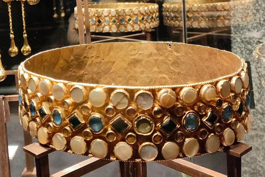 The crown of Queen Theodelinda: A gold band set with rows of gems and mother-of-pearl, linked to Theodelinda, queen of the Lombards, around 600 AD.