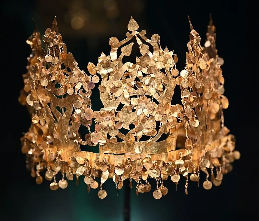 The gold crown of Tillya Tepe: A gold crown of trees and birds hung with small gold discs, from a nomad princess’s grave at Tillya Tepe, Afghanistan, 1st century AD. It folds flat for travel.