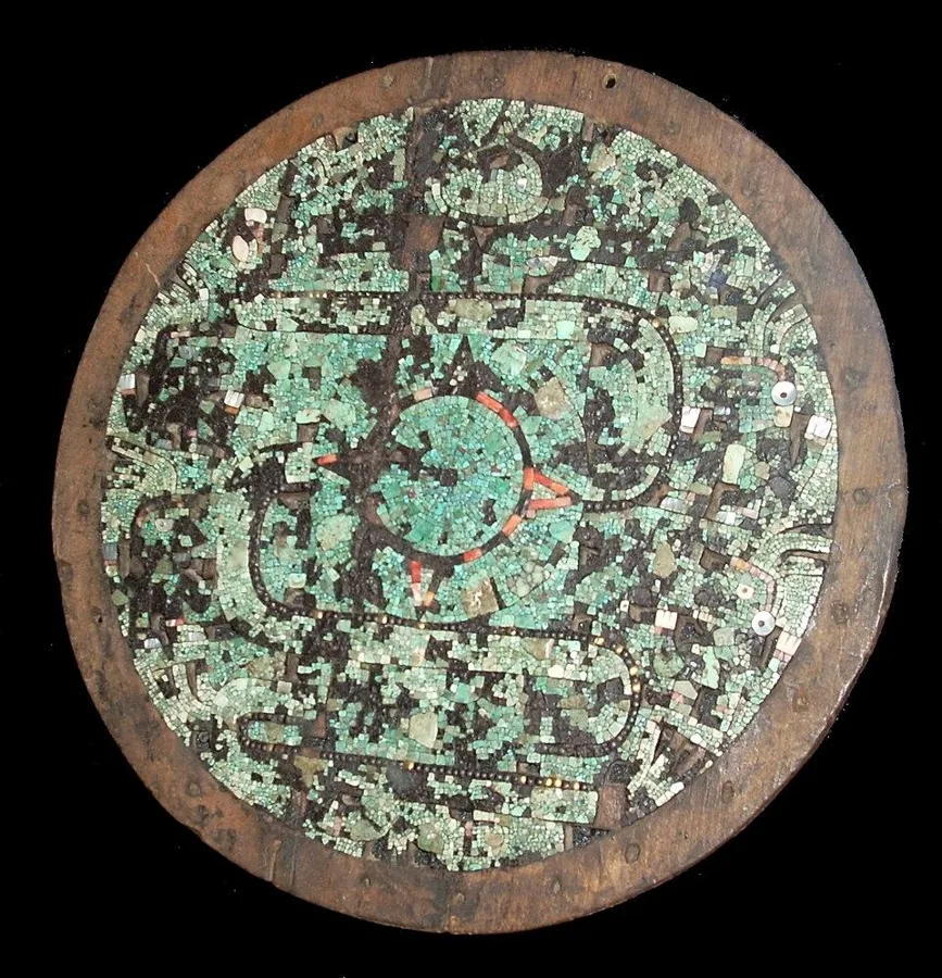 A turquoise mosaic shield: A ceremonial shield covered in turquoise mosaic, Aztec or Mixtec, 15th to 16th century.