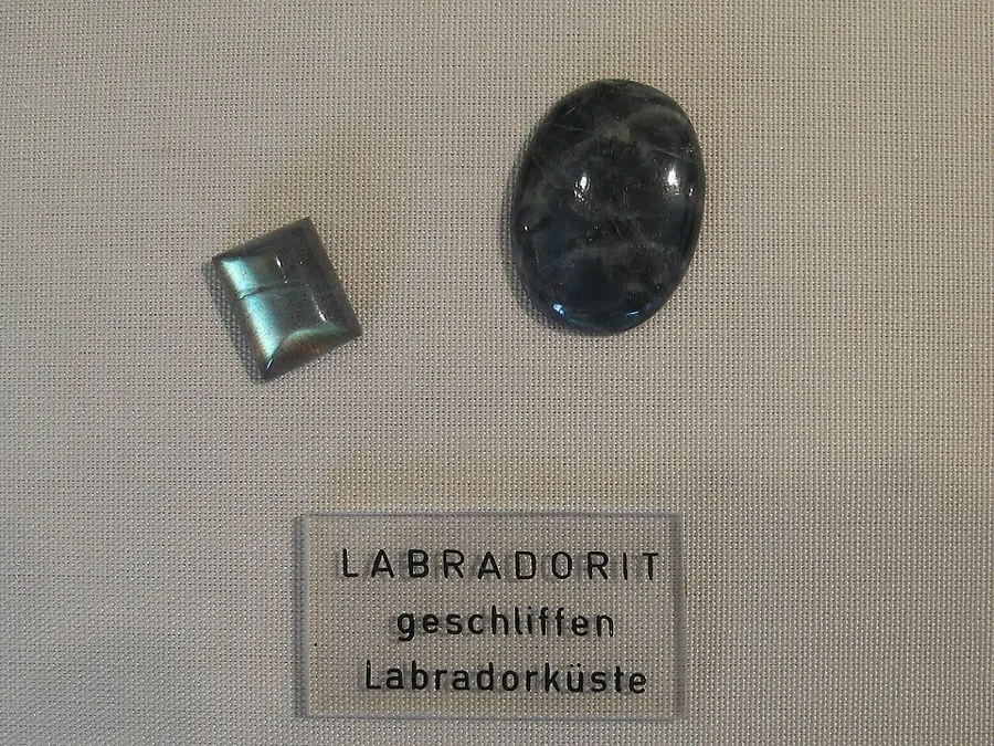 Two cabochons from the Labrador coast: Two domed cabochons of labradorite from the Labrador coast, where the mineral was first described. Labrador coast, Canada, Natural stone, cut as cabochons.