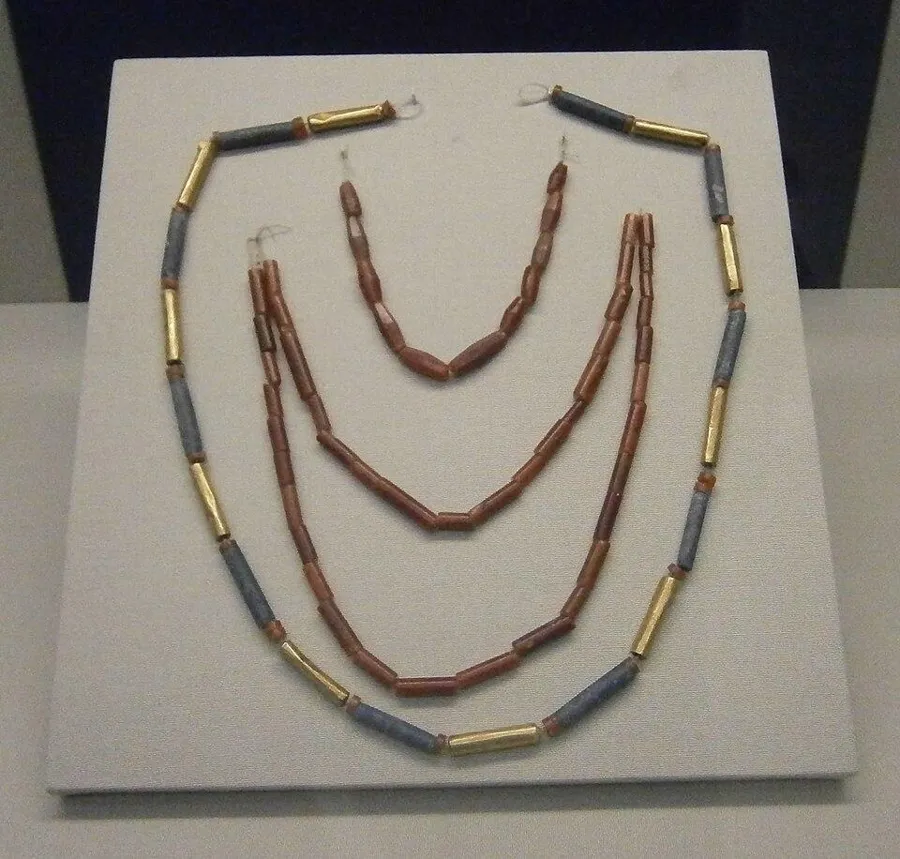 Gold, lapis and carnelian necklaces from Ur: Three necklaces: two of carnelian beads imported from the Indus Valley, and one of gold-covered beads alternating with lapis from Afghanistan, Old Babylonian Ur, about 2000 to 1600 BC.