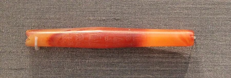 Shulgi's carnelian bead in the British Museum, with its cuneiform dedication to Ninlil.