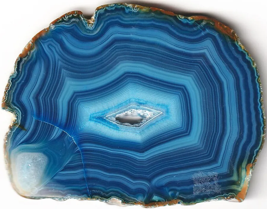 Dyed agate: the colour follows the porous bands. Cheap red "carnelian" is often agate dyed the same way.