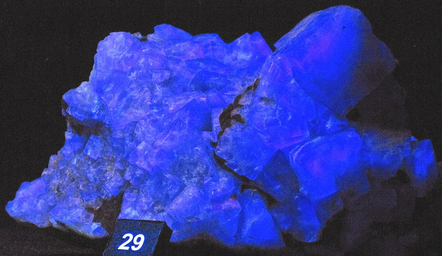 Fluorite glowing blue under ultraviolet light: the effect named after it.