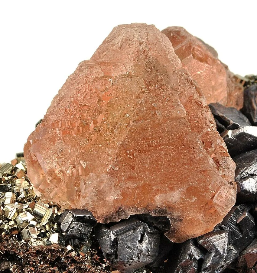 Pink fluorite on pyrite, Huanzala mine, Peru