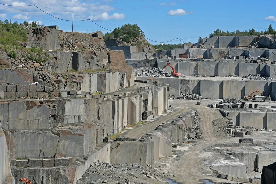 A larvikite quarry near Larvik, Norway, where the stone is cut out in big blocks for building and for counters.