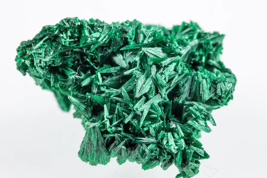 Malachite can also grow as silky needle-like crystals, though most of it forms rounded masses.