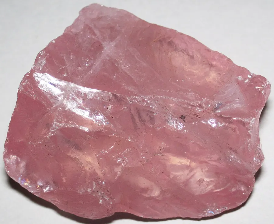 Massive rose quartz: it grows as solid pink masses with no crystal faces.