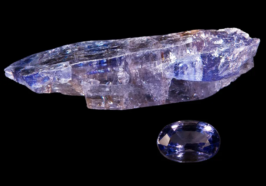Rough and cut tanzanite side by side, both from the C-Block mine at Merelani.